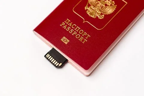 Passport with a memory card embedded on a white background Stock Photos