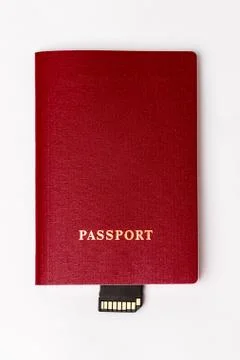 Passport with a memory card embedded on a white background Stock Photos