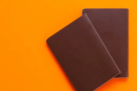 Passport on orange background Stock Photos