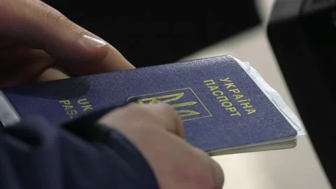 Passport of Ukraine in hand Stock Footage