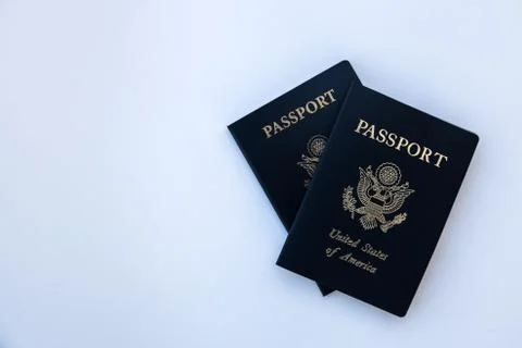 Passports framed to the right on solid background Stock Photos