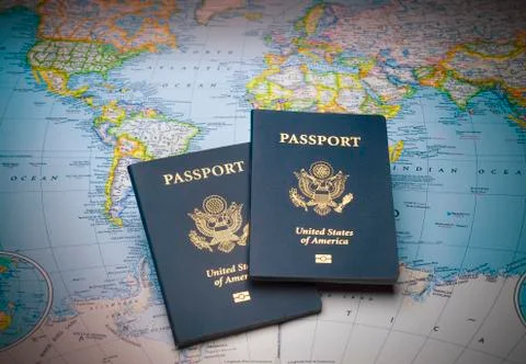 Passports on a map of the world Stock Photos