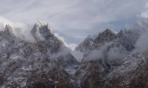 Passu Cathedral mountain peak with cloudy and foggy environment in Pakistan Stock Photos