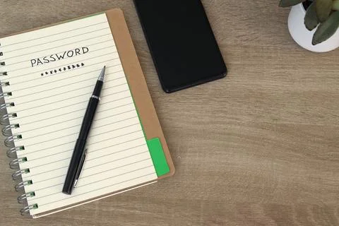 Password Notebook with Pen Beside Blank Smartphone Screen Stock Photos