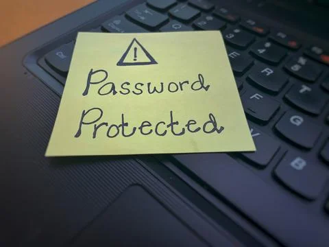 Password protected text written on sticky note on top of a blurred laptop Stock Photos