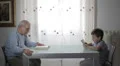 the past and the future, grandfather reading a book and child uses tablet HD Footage