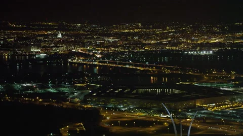 Past the Pentagon at night with traffic on George Mason Memorial Bridge in Stock Footage 59195630