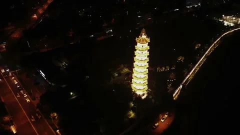 Past The Tower At Night With Traffic Video stock 220839474