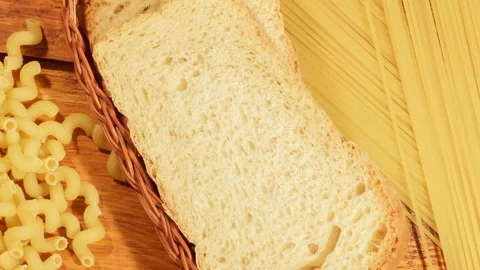 Pasta and bread on a wooden background Stock Footage 73408491