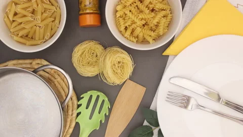 Pasta and kitchen utensil on table moving - Stop motion Stock Footage 130718385