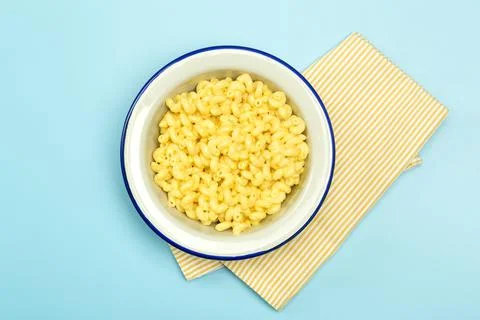 Pasta background. Mac and Cheese pasta on a blue background. American style Stock Photos