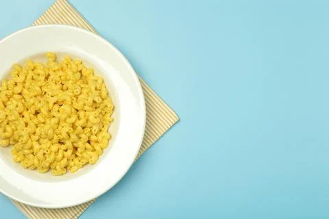 Pasta background. Mac and Cheese pasta on a blue background. American style Stock Photos