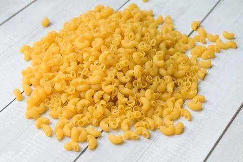 Pasta background, raw macaroni on background, close up raw macaroni pasta u.. Foto stock