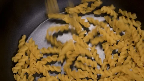 Pasta being poured into a pot Stock-Footage 88254669
