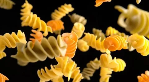 Pasta on black background, close up Stock Photos