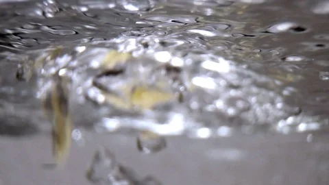 Pasta in boiling water close-up in slow motion. Stock Footage 88629238