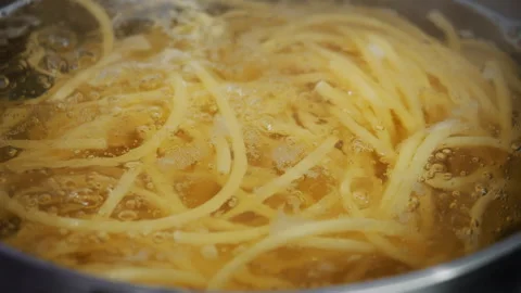 Pasta Boiling in Water in Saucepan Close Up. Stock Footage 346861648