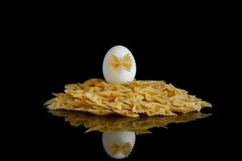 Pasta bows on a black background Stock Photos