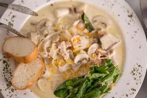Pasta with bread and vegetables at restaurant Stock Photos