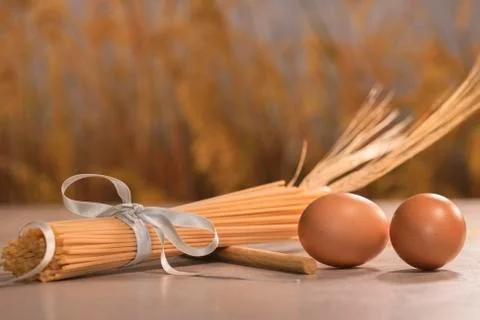 Pasta with brown eggs on a table Stock Photos