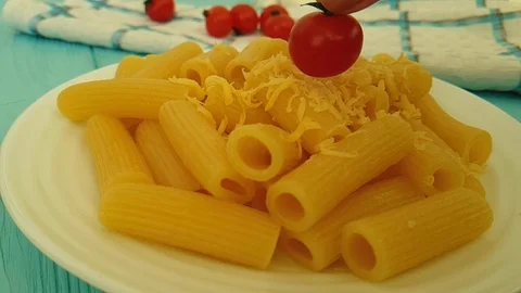 Pasta cheese cherry tomatoes, hand Stock Footage 87827797