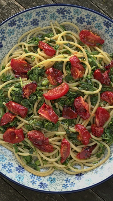 Pasta with Cherry Tomatoes and Arugula. Vertical video. Stock Footage 277217692