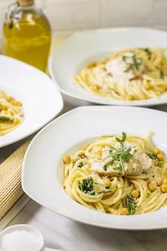 Pasta with chicken and arugula Stock Photos