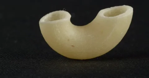 Pasta close-up on a black background. Macro food. The texture of the dry dough. Видео 166494088