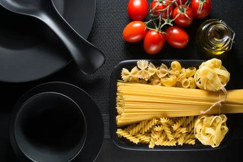 Pasta collection on black table Stock Photos