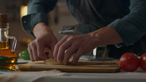 Pasta the cook concentratedly puts spaghetti pasta into nests in a pile of s Stock Footage 249842392