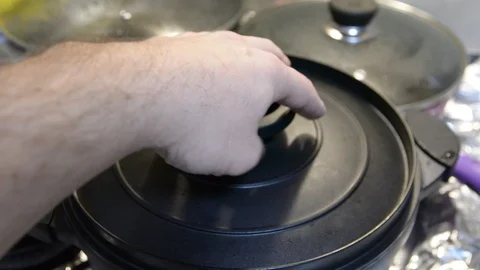 Pasta is cooked in a black cauldron close up, home made, Pasta cooked in a boili 動画素材 101284626