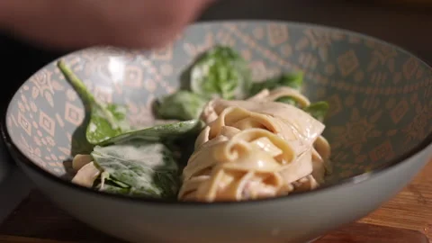 Pasta decorating basil Stock Footage 221850855