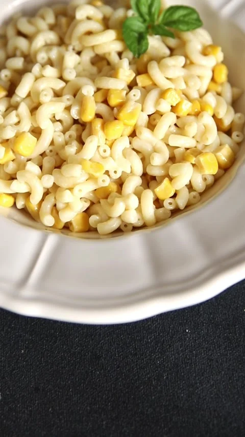 Pasta dish corn and creamy sauce small elbow macaroni small pasta shells Stock-Footage 344988637