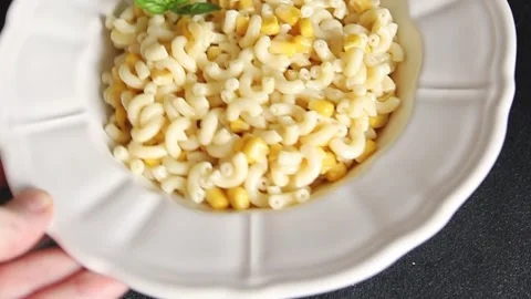 Pasta dish corn and creamy sauce small elbow macaroni small pasta shells Stock-Footage 344988641