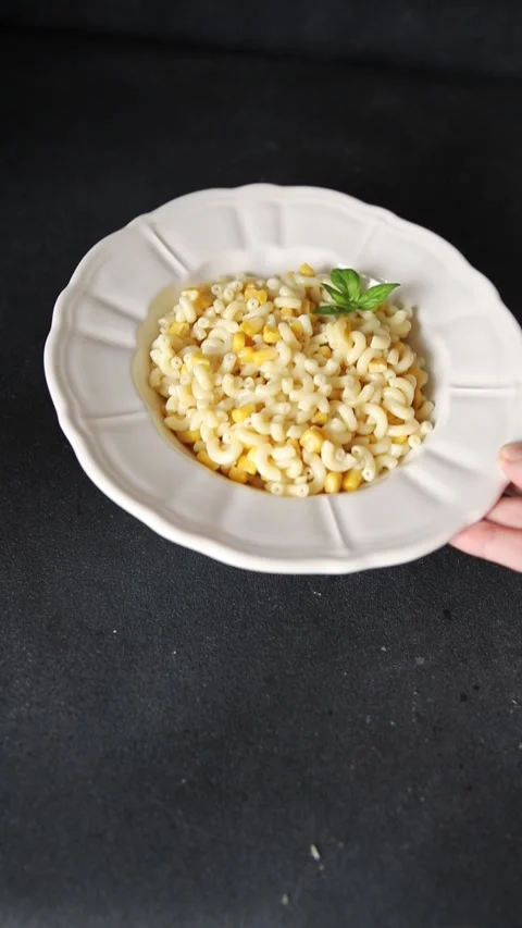 Pasta dish corn and creamy sauce small elbow macaroni small pasta shells Stock-Footage 344988643