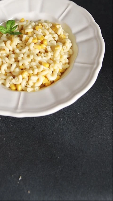 Pasta dish corn and creamy sauce small elbow macaroni small pasta shells Stock-Footage 344988644