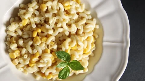 Pasta dish corn and creamy sauce small elbow macaroni small pasta shells Stock-Footage 344988671