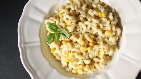 Pasta dish corn and creamy sauce small elbow macaroni small pasta shells Stock-Footage 344988681