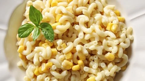 Pasta dish corn and creamy sauce small elbow macaroni small pasta shells Stock-Footage 344988690