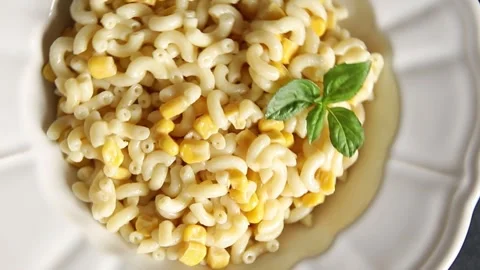 Pasta dish corn and creamy sauce small elbow macaroni small pasta shells Stock-Footage 344988698