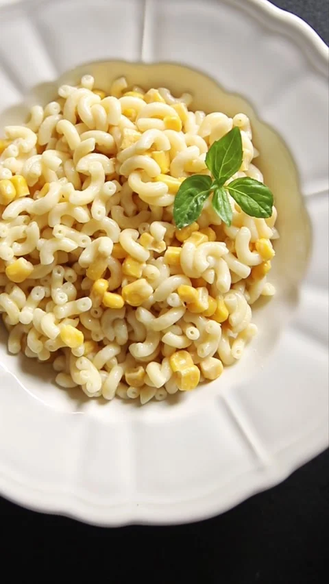 Pasta dish corn and creamy sauce small elbow macaroni small pasta shells Stock-Footage 344988701