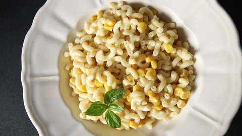 Pasta dish corn and creamy sauce small elbow macaroni small pasta shells Stock-Footage 344988704