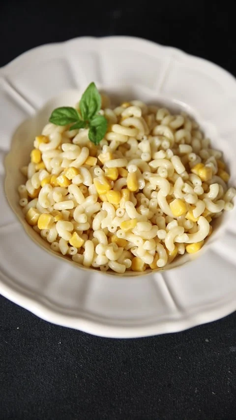 Pasta dish corn and creamy sauce small elbow macaroni small pasta shells Stock-Footage 344988708