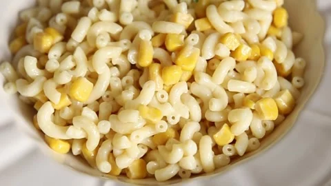 Pasta dish corn and creamy sauce small elbow macaroni small pasta shells Stock-Footage 344988711