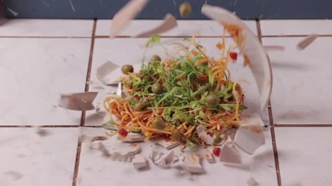 Pasta dish hitting the floor breaking Stock Footage 283843776