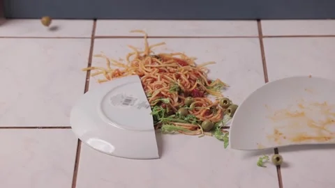 Pasta dish hitting the floor breaking Stock Footage 303598135