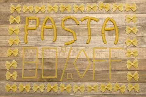 Pasta  eighty percent off text made of raw pasta Stock Photos