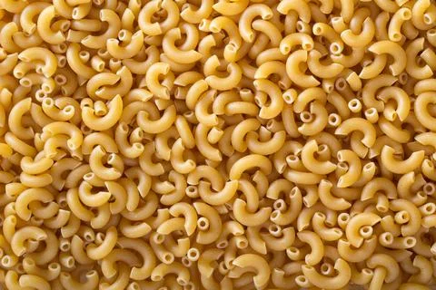 Pasta Elbow Macaroni background Fotos de archivo