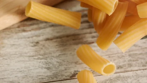Pasta falling and bouncing in slow motion Stock Footage 156810503