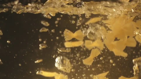 Pasta falling into boiling water Stock Footage 157539271